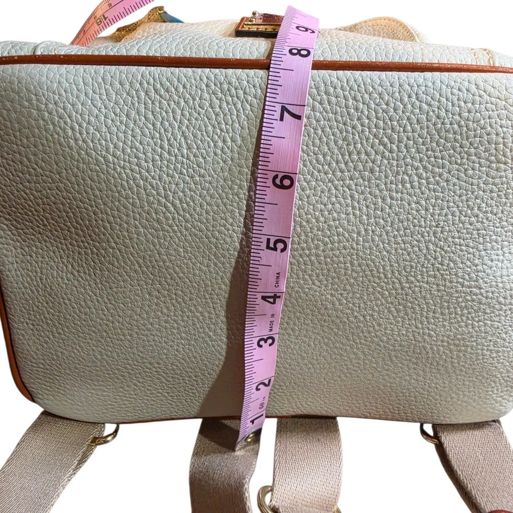 Dooney & Bourke Pebbled Leather Drawstring Backpack White Tan Tassel Logo